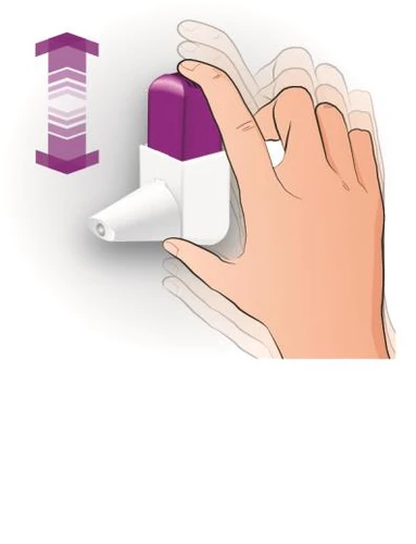 A hand firmly pressing downward on a white medical device with a purple cap, following the direction indicated by a purple arrow