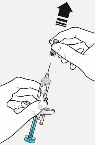 Two hands handling a syringe with needle and a protective cap being removed