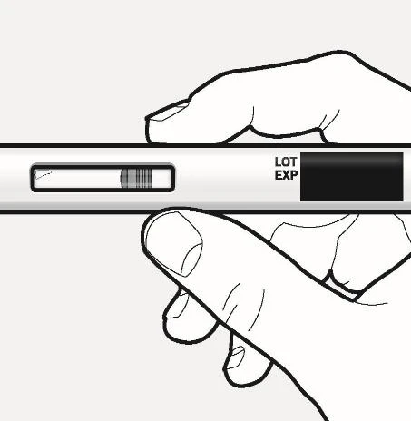 Two hands holding horizontally a white medical device with a transparent window showing the contents and a component