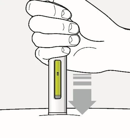 A hand grips a vertical medical device with a yellow window while a gray arrow indicates downward movement toward the skin