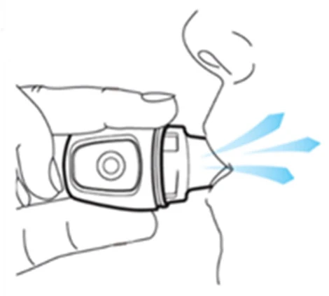 Line drawing of a hand holding an inhaler near an open mouth, with three blue streams indicating the flow of medication exiting