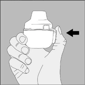 Una mano sostiene un dispositivo médico blanco con una flecha negra que indica un movimiento lateral hacia la izquierda