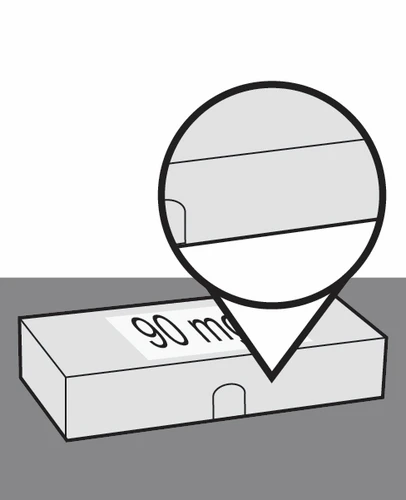 Dibujo esquemático de una caja rectangular con la inscripción 90 mg y un aumento circular que muestra el detalle de la parte superior