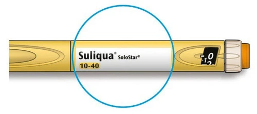 Żółto-biały długopis iniekcyjny Suliqua SoloStar z oznaczeniem dawki 10-40 i okienkiem wyświetlającym dawkę na białym tle