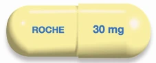 Cápsula amarilla con la inscripción ROCHE en azul en un lado y la indicación 30 mg en el otro