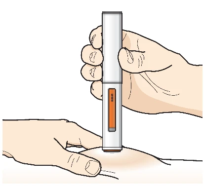 A hand holding a vertical injection pen while the