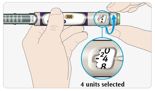 Dos manos sostienen una pluma inyectora con un aumento que muestra la dosis de 4 unidades seleccionada en la pantalla numérica