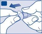 Two hands holding a cylindrical medical device and moving it to the left following the direction of a blue arrow toward a dark square