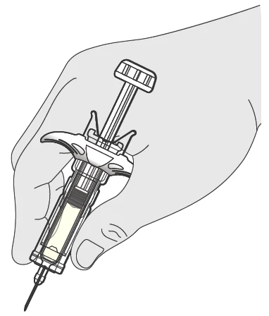 A hand holding a syringe with liquid inside
