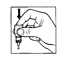 A hand pressing down the cap of a bottle to release a drop of liquid from a nozzle