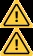 Dos símbolos de advertencia idénticos compuestos por un triángulo amarillo con borde negro y un punto de exclamación negro en el centro superpuestos verticalmente
