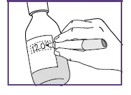 A hand writing the date '12.06' on a