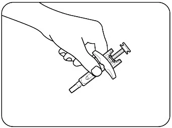 Una mano sostiene una jeringa con un dispositivo de protección blanco y un émbolo para la