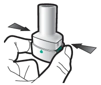 Two hands squeezing a cylindrical white medical device with black arrows indicating lateral pressure toward the center