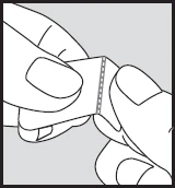 Two hands carefully pulling apart a small container or single-dose package along a central perforated line