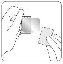 Two hands separating two thin rectangular medical patches with visible dots along the edges on a light background