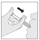 A hand holding a syringe directed toward the open mouth of a person, a black arrow indicating the downward movement of the syringe toward the oral cavity