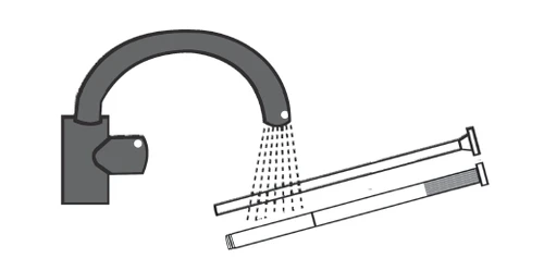 Faucet with flowing water rinsing two thin, long vials or syringes positioned under the stream of liquid