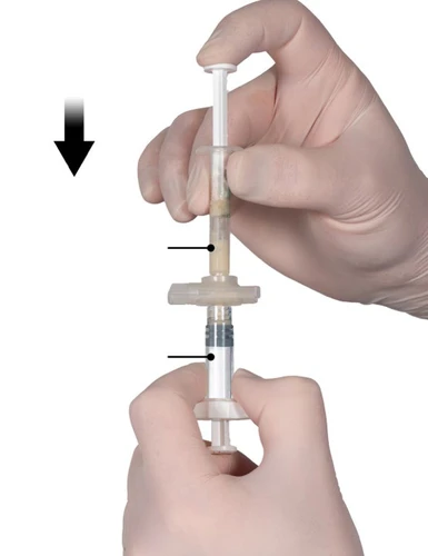 Hands wearing white gloves holding a syringe with a clear liquid, with black arrows indicating the plunger and the level of substance inside the cylinder