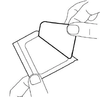 Two hands holding and opening a white, square package or sachet, revealing its empty interior in a top-down view