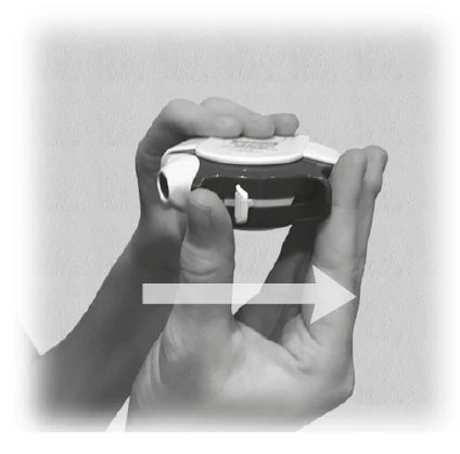 Hands holding a black and white inhaler with a white arrow pointing to the right, indicating the direction of device movement
