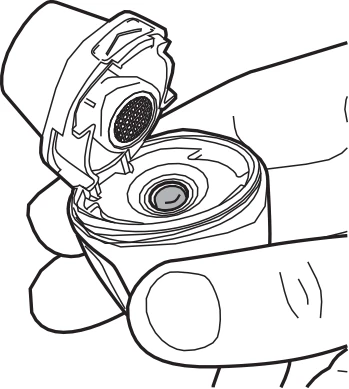 Hands holding an open medical package, showing the internal part of the device with a circular component and an opening in the cover