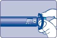 Primo piano della mano che ruota la manopola dell'iniettore blu a penna per impostare la dose del farmaco visualizzata su un piccolo display digitale