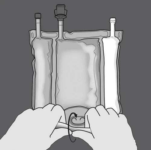 Two hands holding and rotating the bottom valve of a medical fluid bag, which has three upper tubes with caps, on a dark background