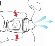 Hand holding an inhaler directed towards the mouth, with blue streaks symbolizing sprayed medication and red arrows indicating device movement