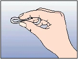 Right hand holding a small, round object gently bent into an arc by finger pressure against a bright bluish background