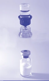 Transparent glass vial with white powder and a vertically positioned applicator with liquid on a light blue background