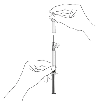 Two hands assembling a needle onto the syringe, one holding the upper part of the packaging and the other stabilizing the syringe barrel with the plunger