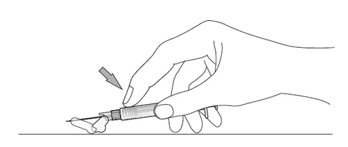 Hand holding a syringe with needle being inserted at an angle into tissue, indicated by an arrow on a white background