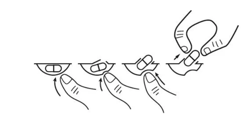Diagram showing instructions for opening a medication package, depicting fingers pressing and prying the edge of a blister pack to remove a tablet