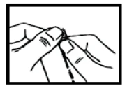 Two hands holding and separating a thin strip of material or medication packaging component to open or prepare it for use