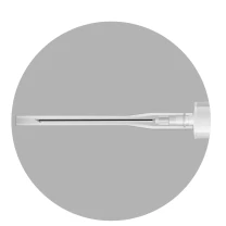 Close-up of a thin, white medical needle with a plastic hub placed on a gray, circular background