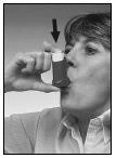 A woman holds a small cup near her mouth, preparing to take liquid medication, a black-and-white profile view of the face