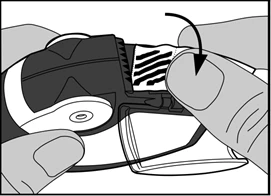 Hands holding a medical device, one finger pressing a button with an arrow indicating rotation to adjust the dose