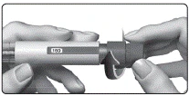 Hands holding an injection device with the number '150' visible on the body, fingers pressing the mechanism to deliver the medication dose