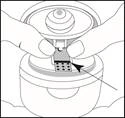 Hands inserting an ampoule into a special device for opening, with an arrow indicating the insertion point of the ampoule into the device