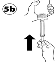 Hand holding the syringe, the other hand pulling the plunger upward, direction indicated by an arrow, step marked as 5b in the corner