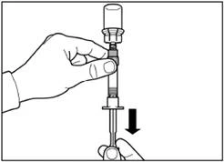 Hand holding a syringe vertically, the other hand pressing the plunger downward to expel air from the syringe prior to injection