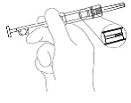 A hand holding a syringe with a scale, needle inserted at an angle, close-up view showing the solution level inside the syringe barrel
